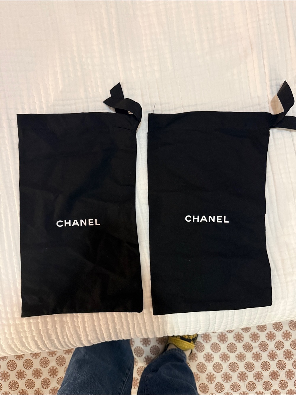 CHANEL Black Drawstring Pouches with White Logo